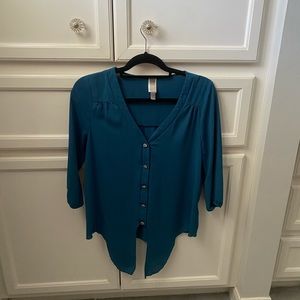 Turquoise blouse.